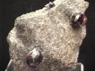 Garnets in situ from
 mineral.galleries.com